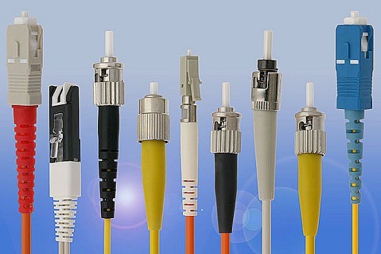 A row of fiber optic connectors — LC, SC, ST and FC types — of the kind the module families terminate